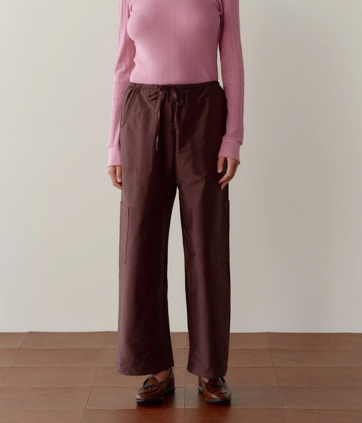 DONNI. Silk Taffeta Cargo Pant in Espresso styled on model, front view showing relaxed fit.