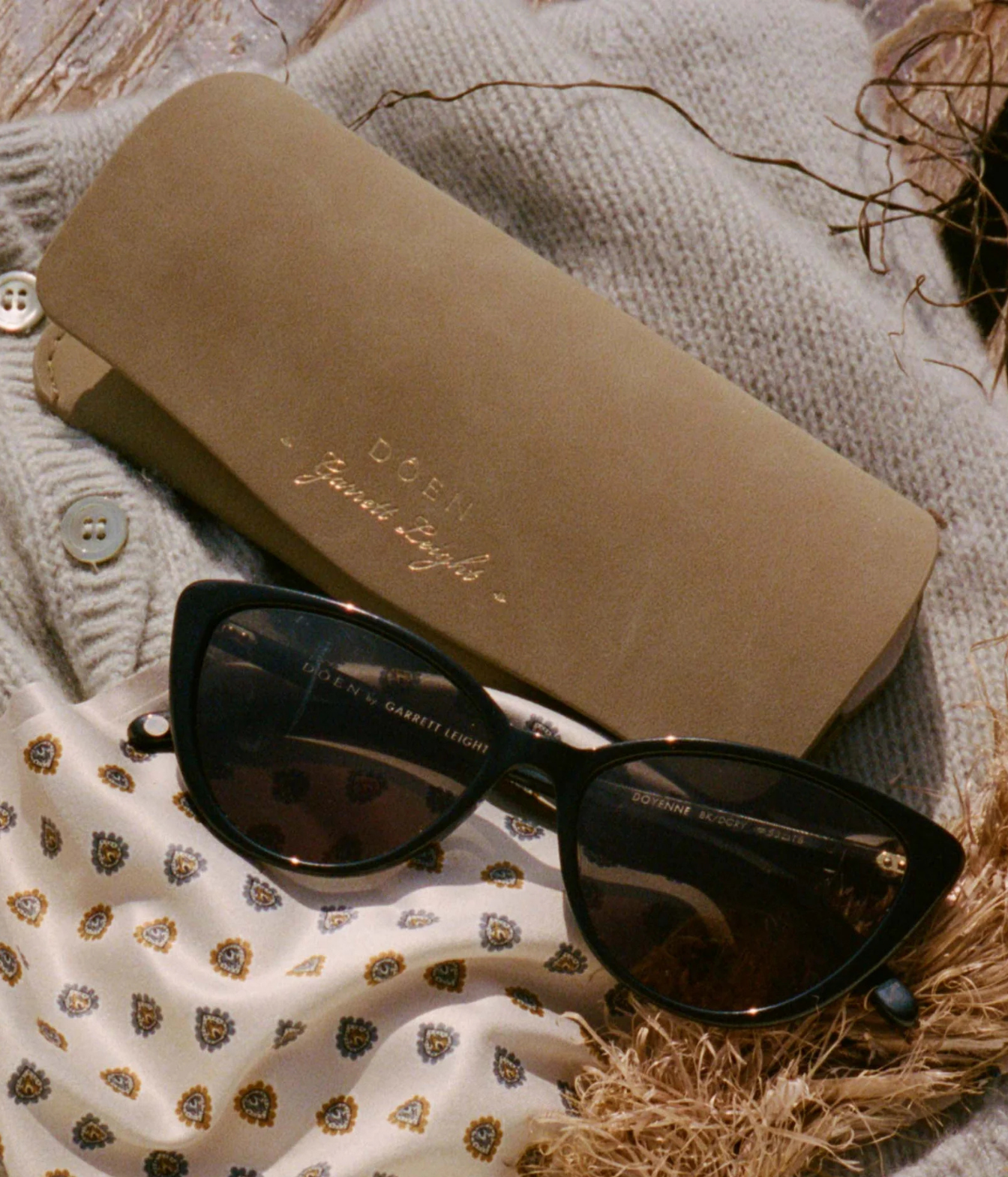 Black cat-eye sunglasses with dark lenses