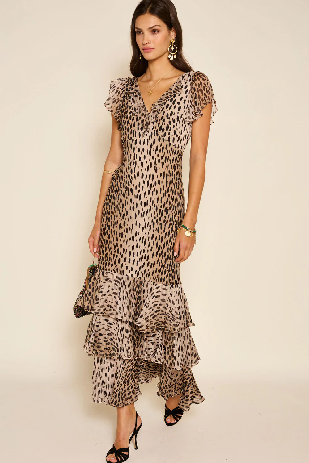 The Amelle Dress in Antelope Spot Black by Rixo is a sophisticated yet playful piece that exudes effortless elegance.