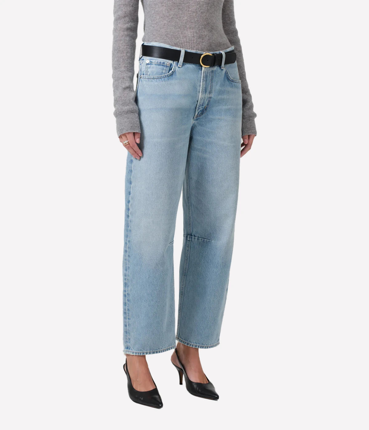 ALT Text: Light indigo tapered barrel-leg jeans with subtle fading, rigid cotton fabric, and a relaxed fit through the top block.