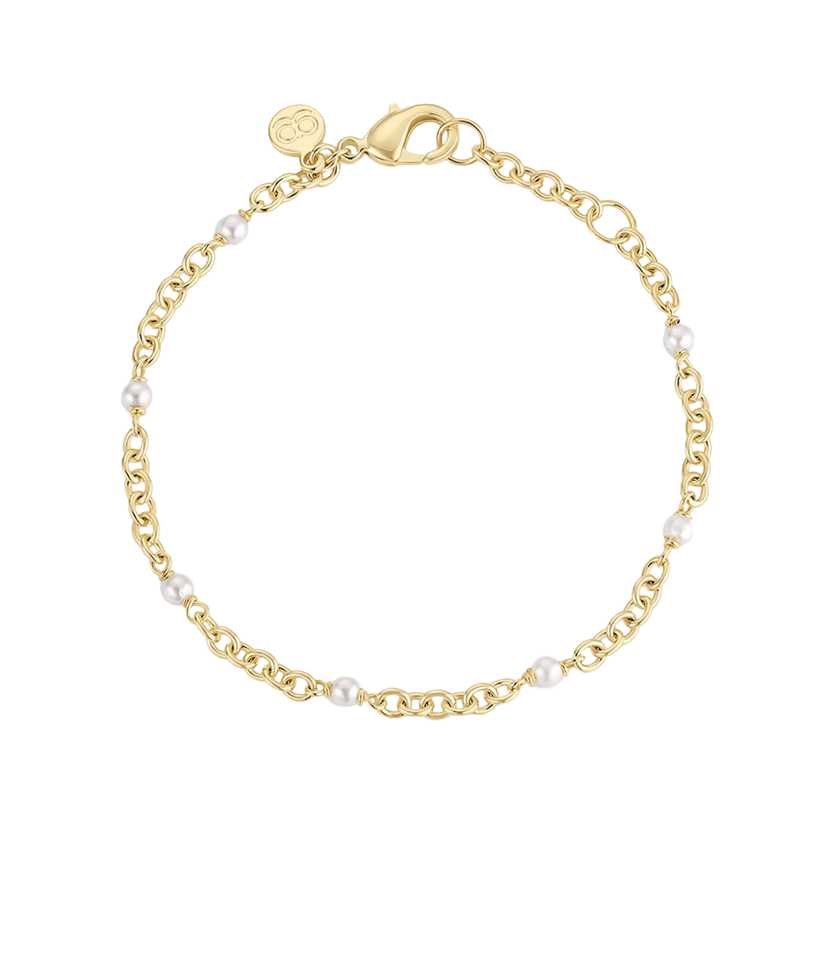 Gorjana Finley Pearl Dot Bracelet in Yellow Gold laid flat in a circle, showing the link chain with small pearls spaced along it and the lobster clasp with a round logo tag
