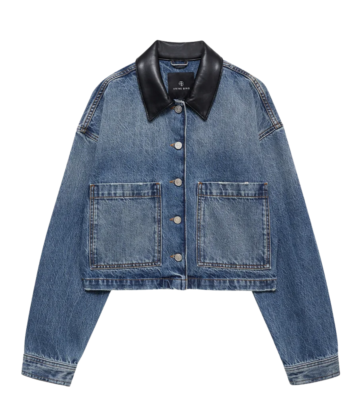 A cropped blue denim jacket with a black leather collar, featuring two front patch pockets and button closures, shown flat on a white background.