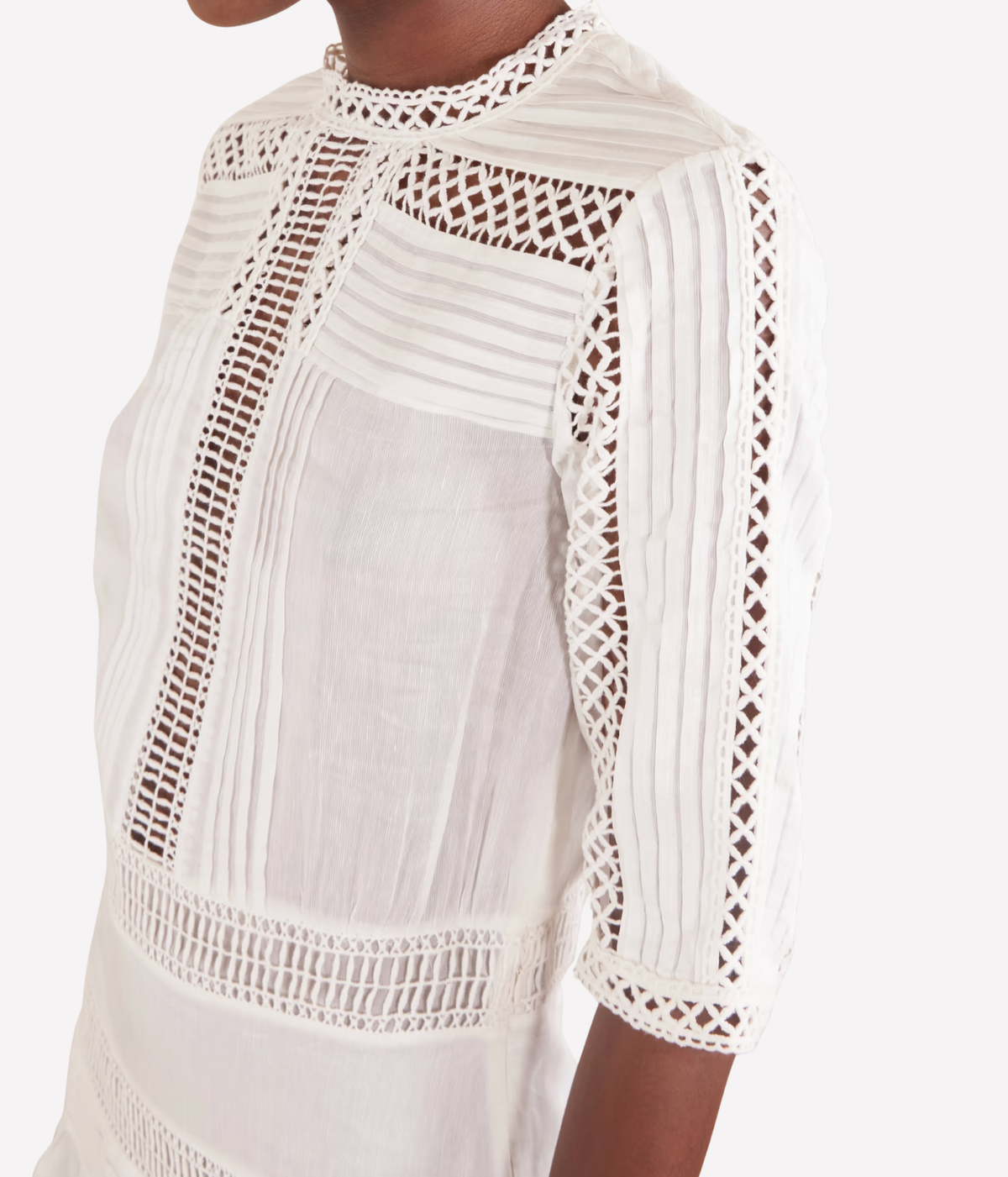 Close-up of the Isabel Marant Paige Dress In White dress with textured vertical panels and elbow-length sleeve