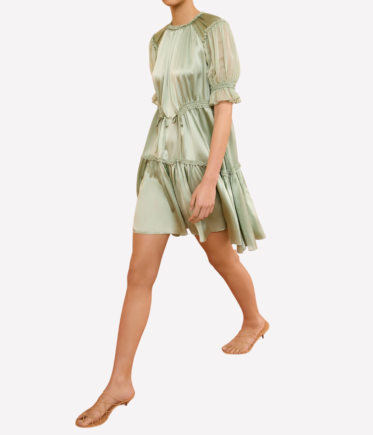 Model walking in the Juliette Short Sleeve Mini Dress in Cleadon, showing the lightweight drape, puff sleeves and softly flared mini silhouette.