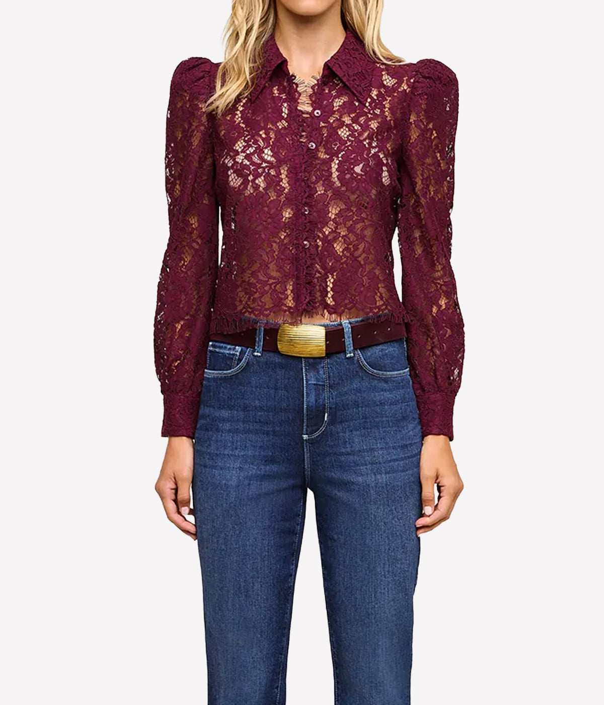 L'Agence Anita Lace Blouse In Deep Sangria - model wearing red lace blouse and blue denim jeans