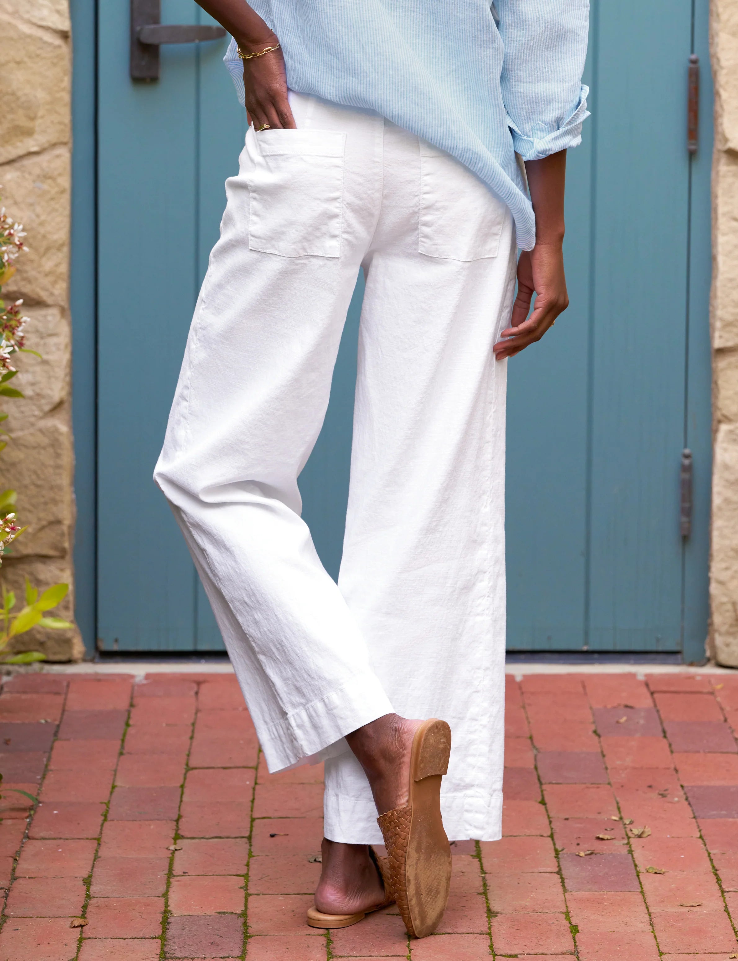 ALT Text: High-rise wide-leg trousers in Italian Performance Linen with a cropped clean hem and back patch pockets for a sleek and flattering look.
