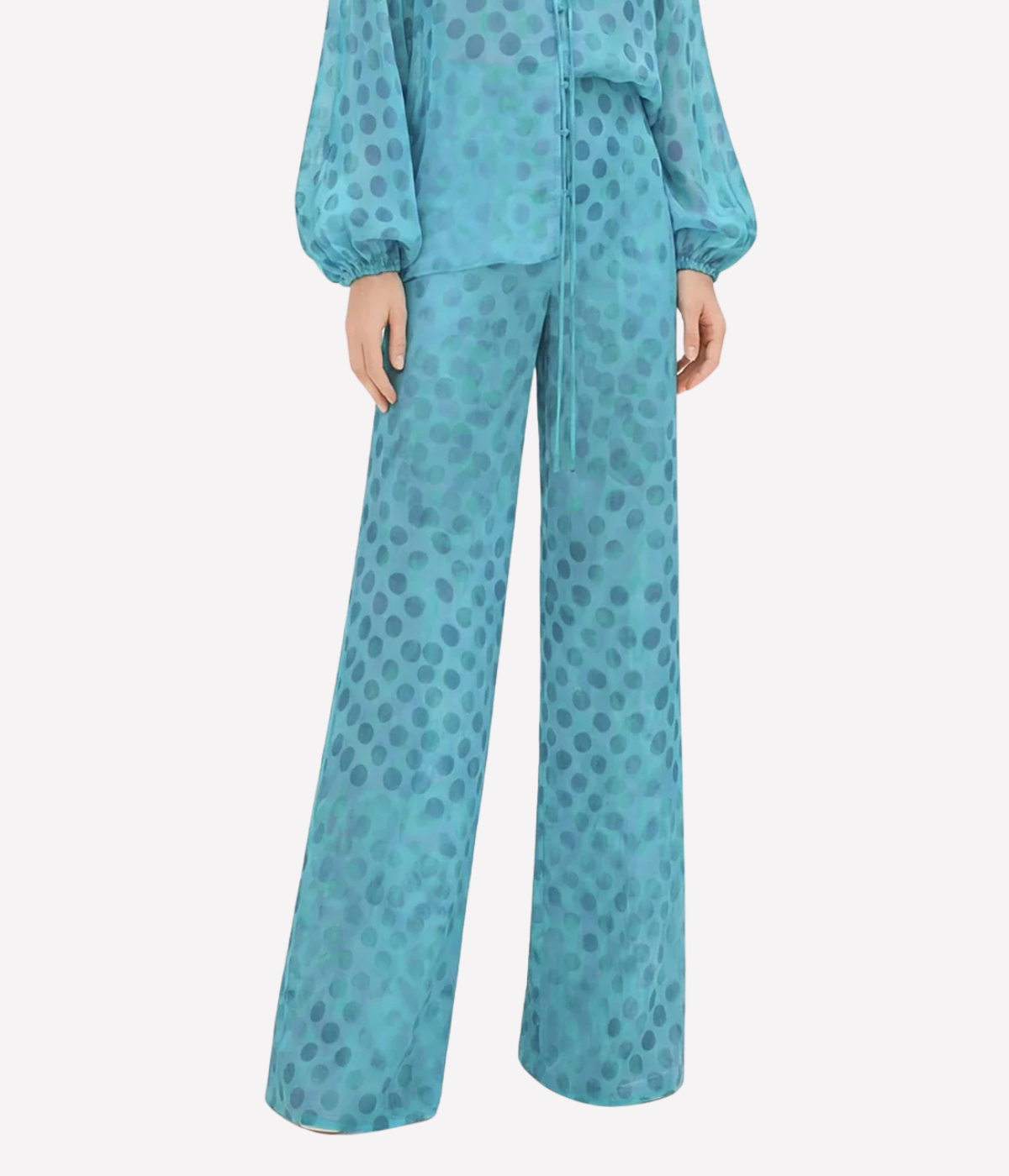 Teal polka dot outfit on a white background