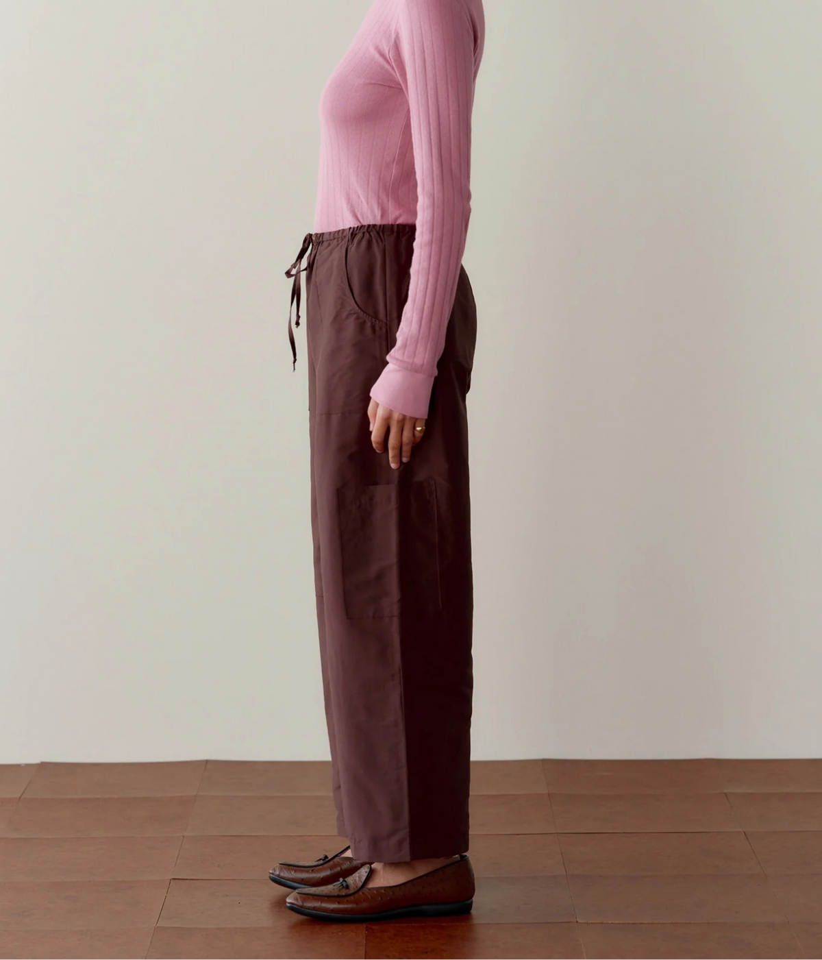 DONNI. Silk Taffeta Cargo Pant in Espresso styled on model, side profile showing relaxed wide leg