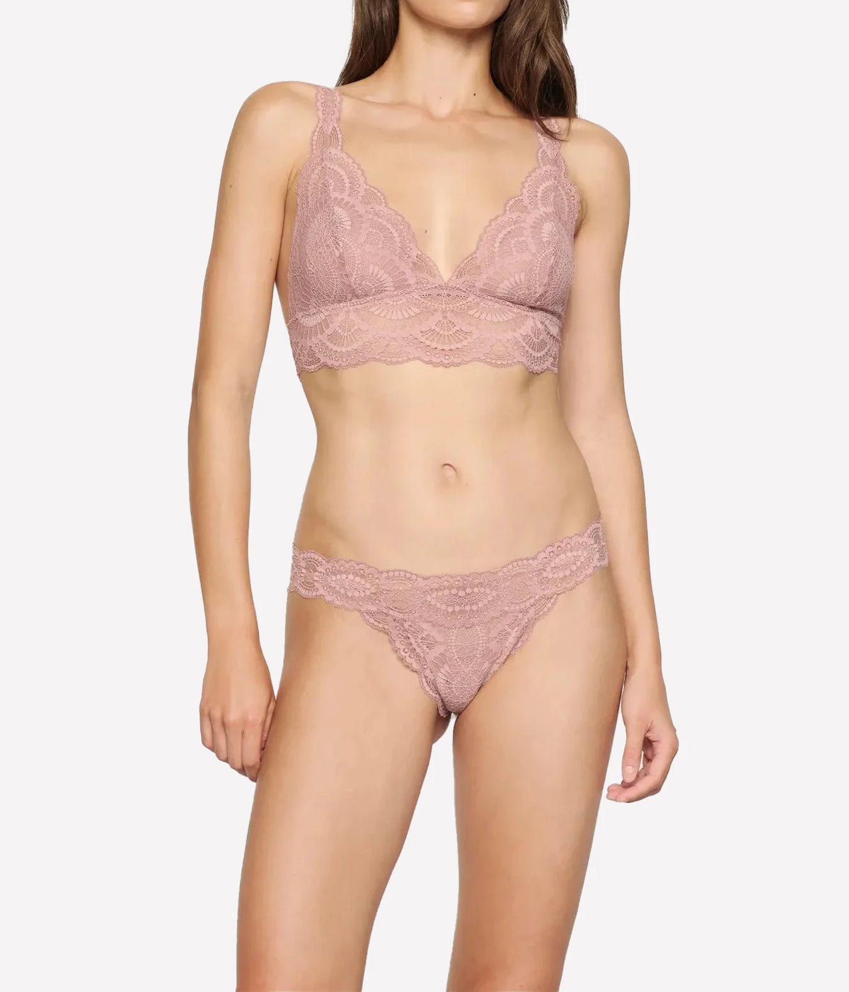 Full-length front view of a model wearing the Eberjey Mariana Bralette in Woodrose with the matching lace thong