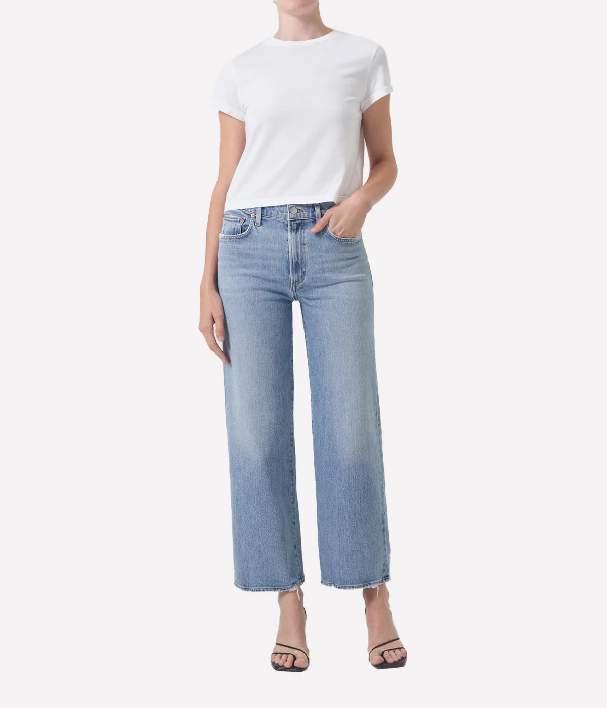 ALT Text: Relaxed mid-rise Harper Jean in light indigo with a cropped wide leg, subtle fading, and finished hems for a chic, casual style.