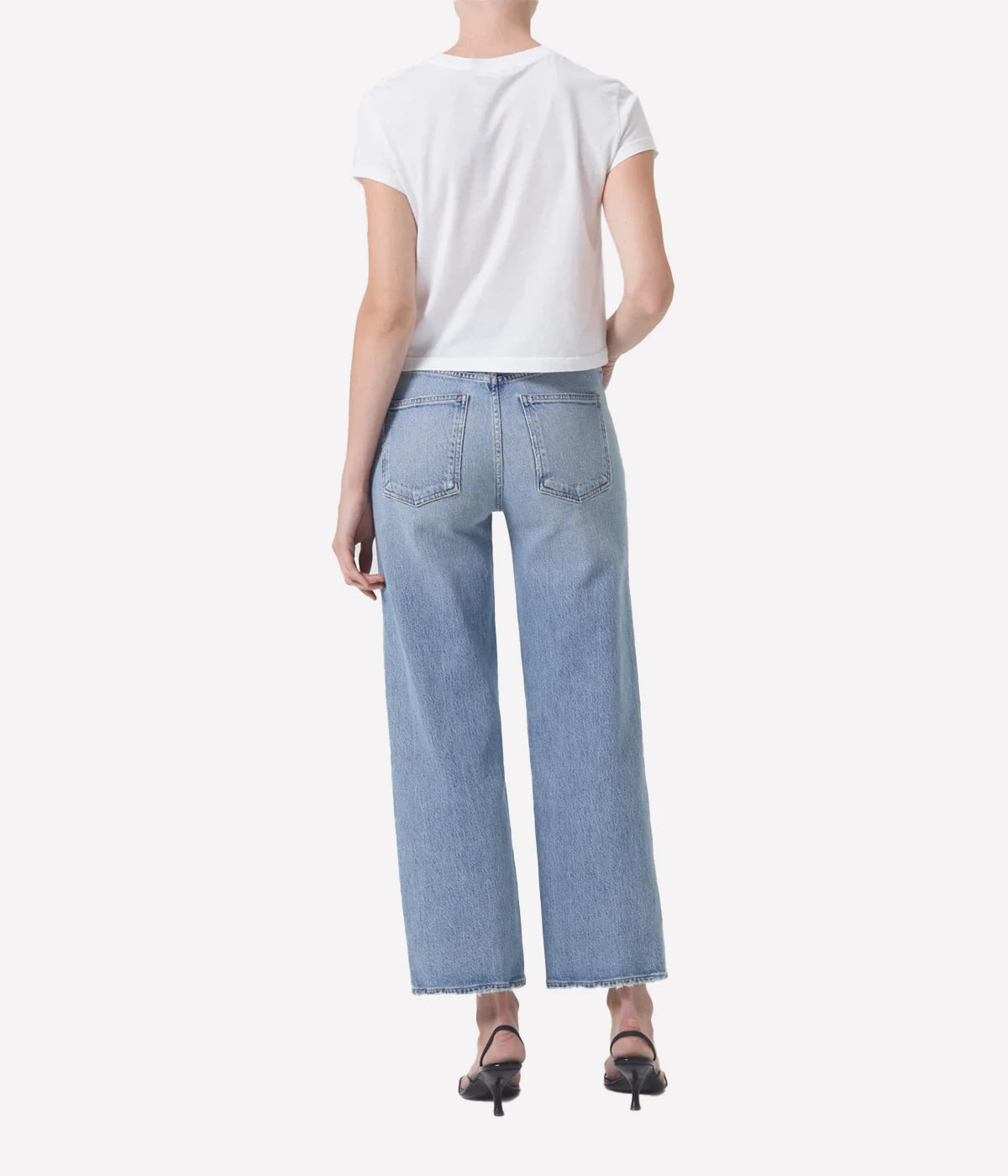 ALT Text: Relaxed mid-rise Harper Jean in light indigo with a cropped wide leg, subtle fading, and finished hems for a chic, casual style.