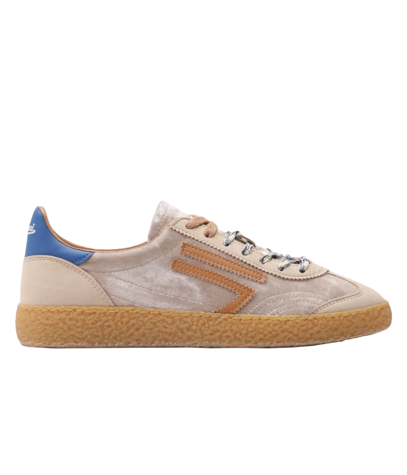 A low-top sneaker in beige suede and leather with a textured tan sole, brown side stripes, a blue heel tab, and silver eyelets, shown in a side profile on a white background.