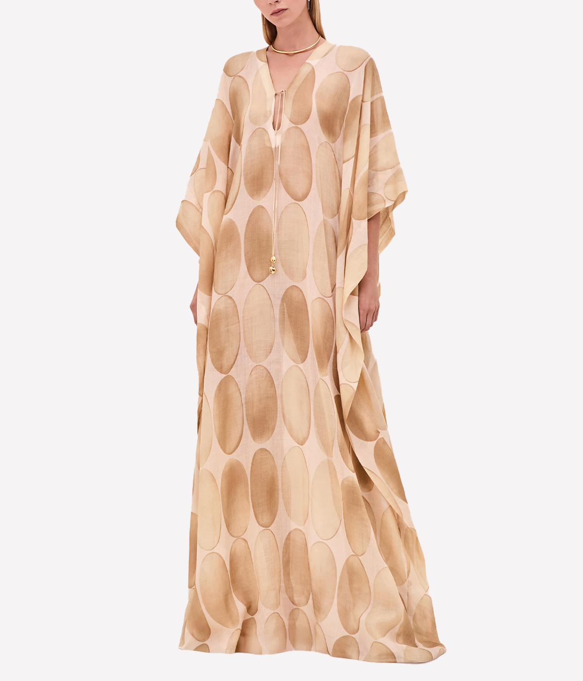 ALT text: White caftan-style maxi dress by Alexis with decorative cord ends and a slip for coverage.