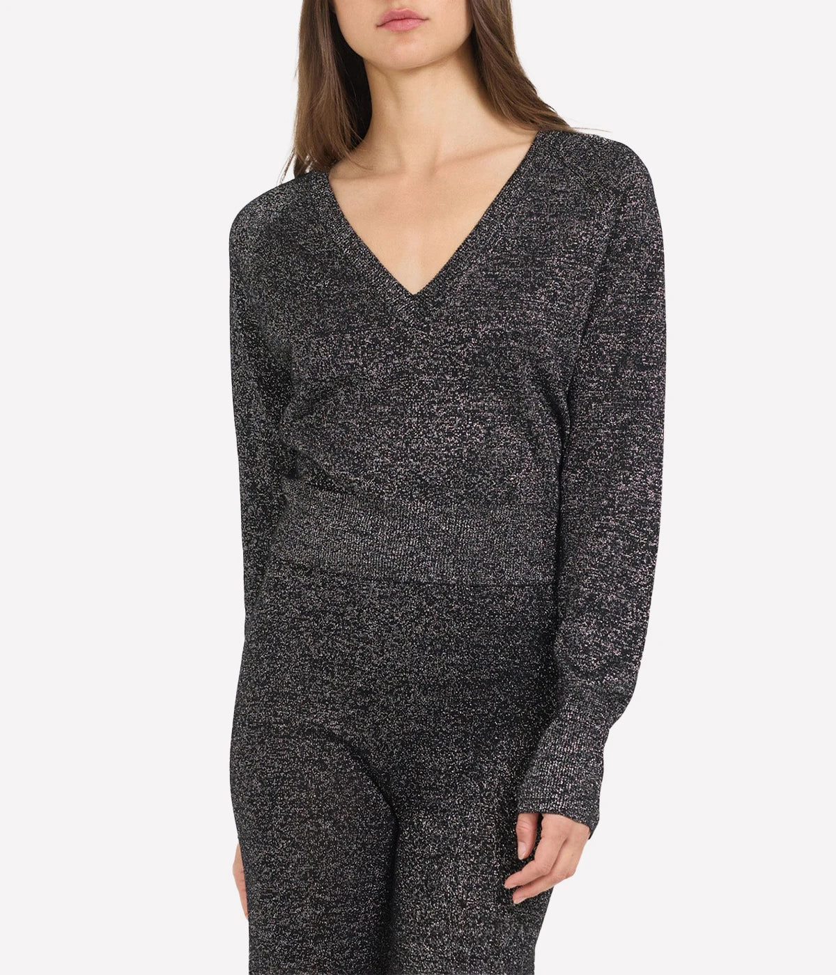 Soft Metallic Viscose Blend: Crafted from 80% viscose, 11% polyester, and 9% metallic, this fabric feels luxurious against the skin while adding a festive shine.
Flattering V-Neck Design: A classic V-neckline that enhances the silhouette and flatters all body types.
Versatile Styling: Pair with Aurora Pants, dressy trousers, or skirts for a chic, coordinated look.
Perfect for the Holidays: Subtle metallic detailing makes this top a perfect choice for holiday events or stylish everyday wear.