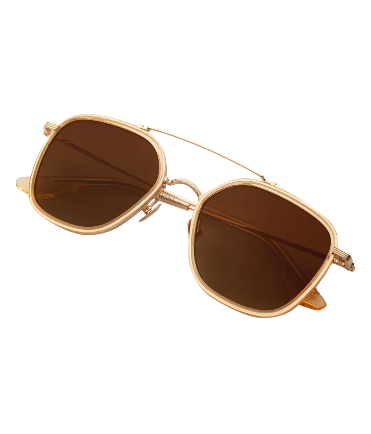 Angled view of the KREWE Austin Sunglasses in 18K Titanium Champagne, showing the champagne acetate rims and gold hardware