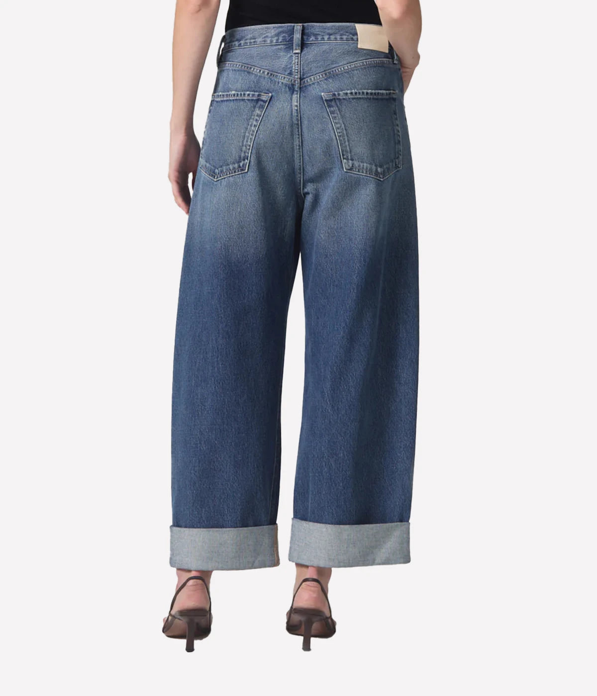 Relaxed-fit Ayla Jeans with a cuffed leg, styled with an oversized blazer and boots for a chic, vintage-inspired look.