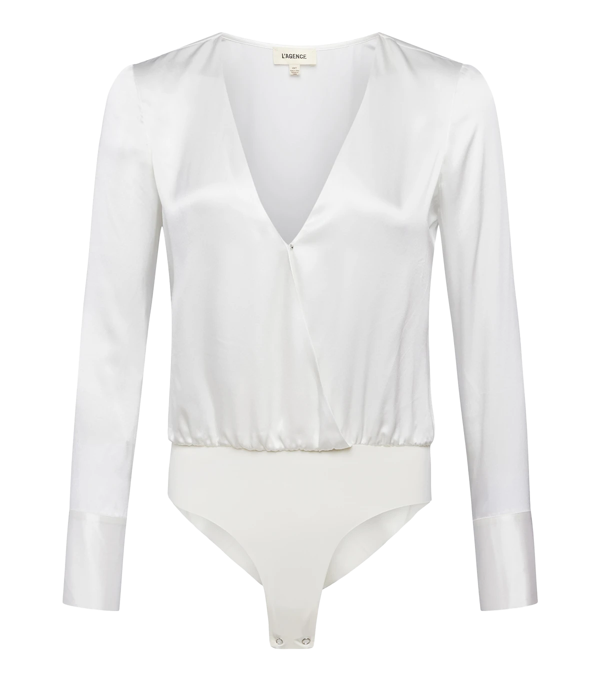 A sexy white plunge neck bodysuit made from luxurious silk material, featuring long sleeves, extended cuffs, button up detailing, and laser cut body suit pantie. Elevated basic, line free look, snap closure, date night top, bra friendly, throw on and go, comfortable, made internationally.   