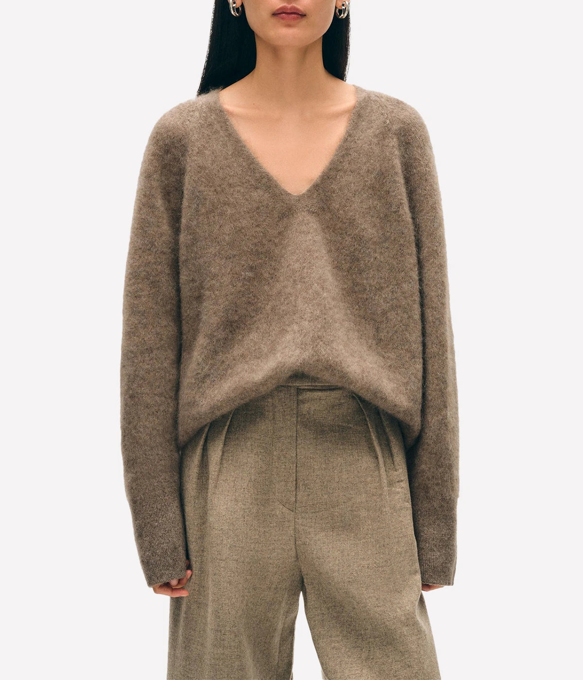 ALT text: White + Warren brushed cashmere V-neck sweater in Taupe, styled loosely over jeans for a relaxed luxe look.