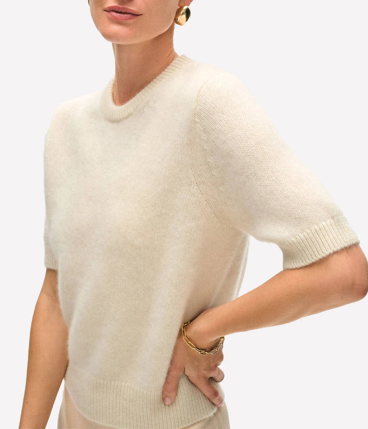 ALT text: White + Warren brushed cashmere tee in soft neutral, styled with relaxed trousers for a luxe everyday look.