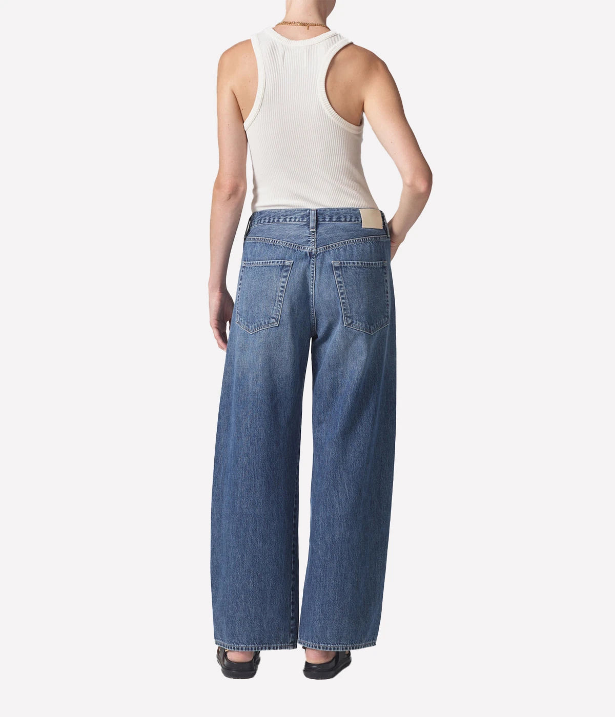 ALT Text: Brynn Jean in lightweight denim, featuring a wide leg, drawstring waist, and full-length inseam, made from 100% organic cotton for a relaxed yet sophisticated look.
