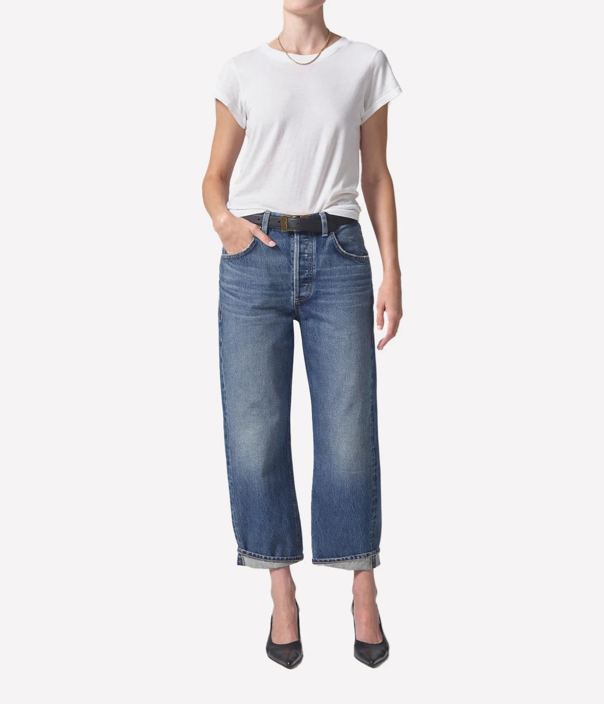 ALT Text: Relaxed vintage tapered jeans in a light indigo wash, styled with a low-rise fit and baby rolled cuffs.