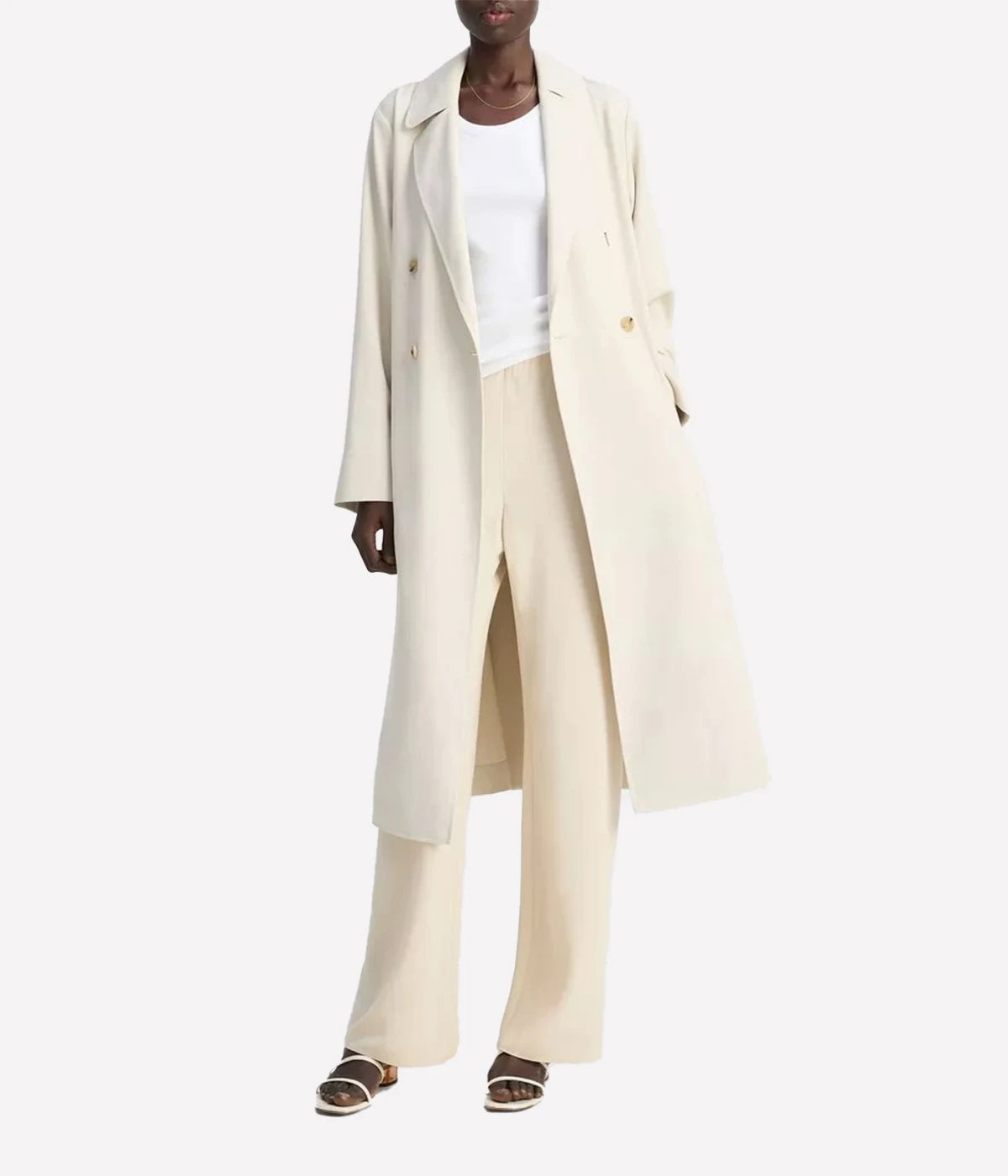 Vince lightweight women's trench coat in beige with classic button-front, self-tie belt, storm flap, and adjustable cuffs – breathable viscose-blend outerwear