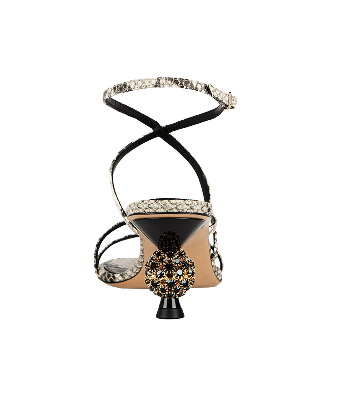 The sandal has black strappy lines wrapping around the foot and ankle, a black heel counter, a beige insole, a snakeskin-patterned strap