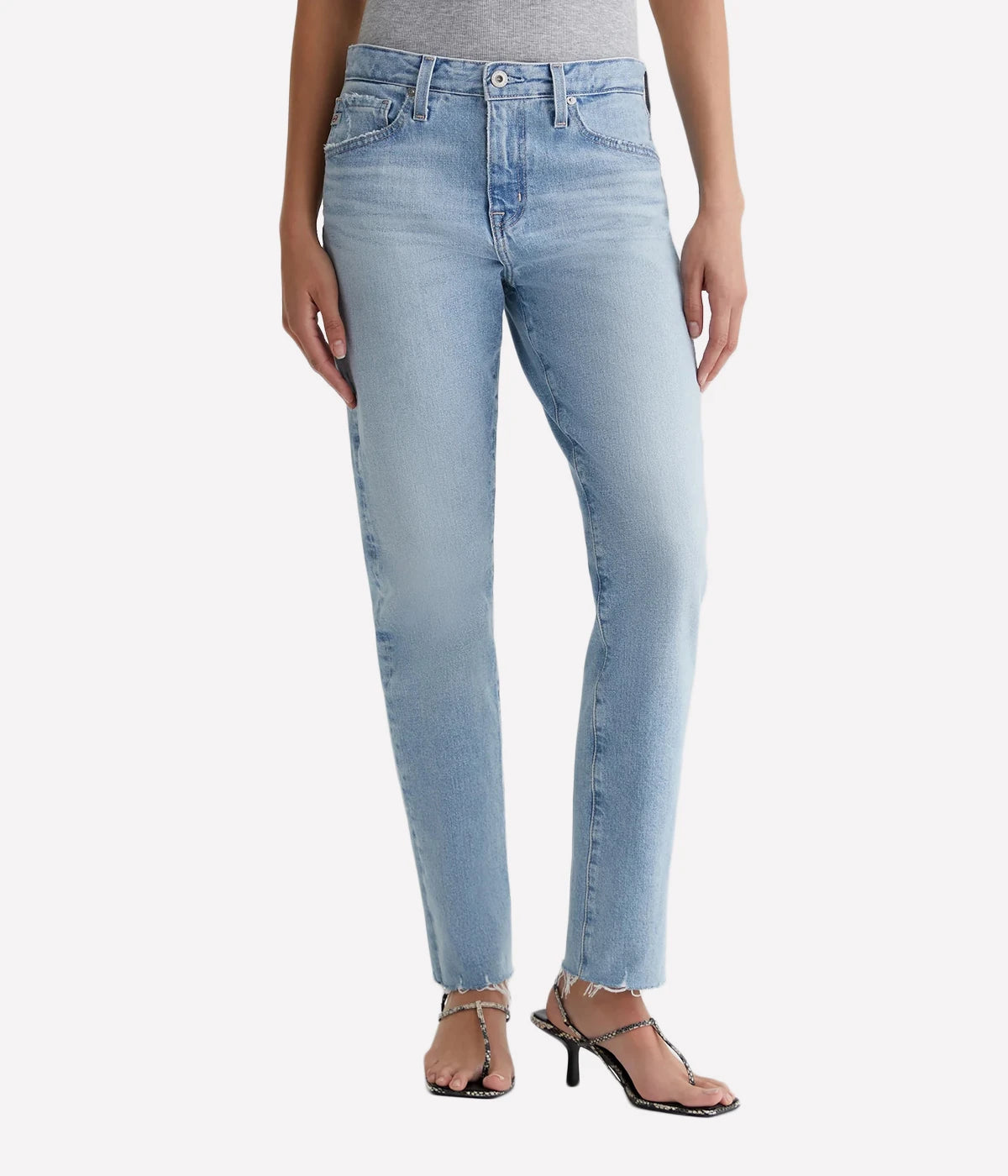 A slim, relaxed fit jean with raw hems and distressing in a light blue wash. Pair this versatile wash and wear AG jean with anything in your closet.