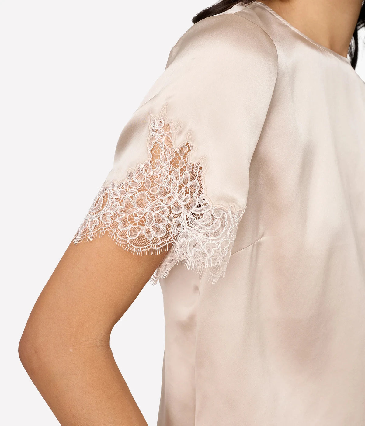 Close-up of Cami NYC Marguerite Silk Top in Oat showing the sheer corded lace sleeve trim