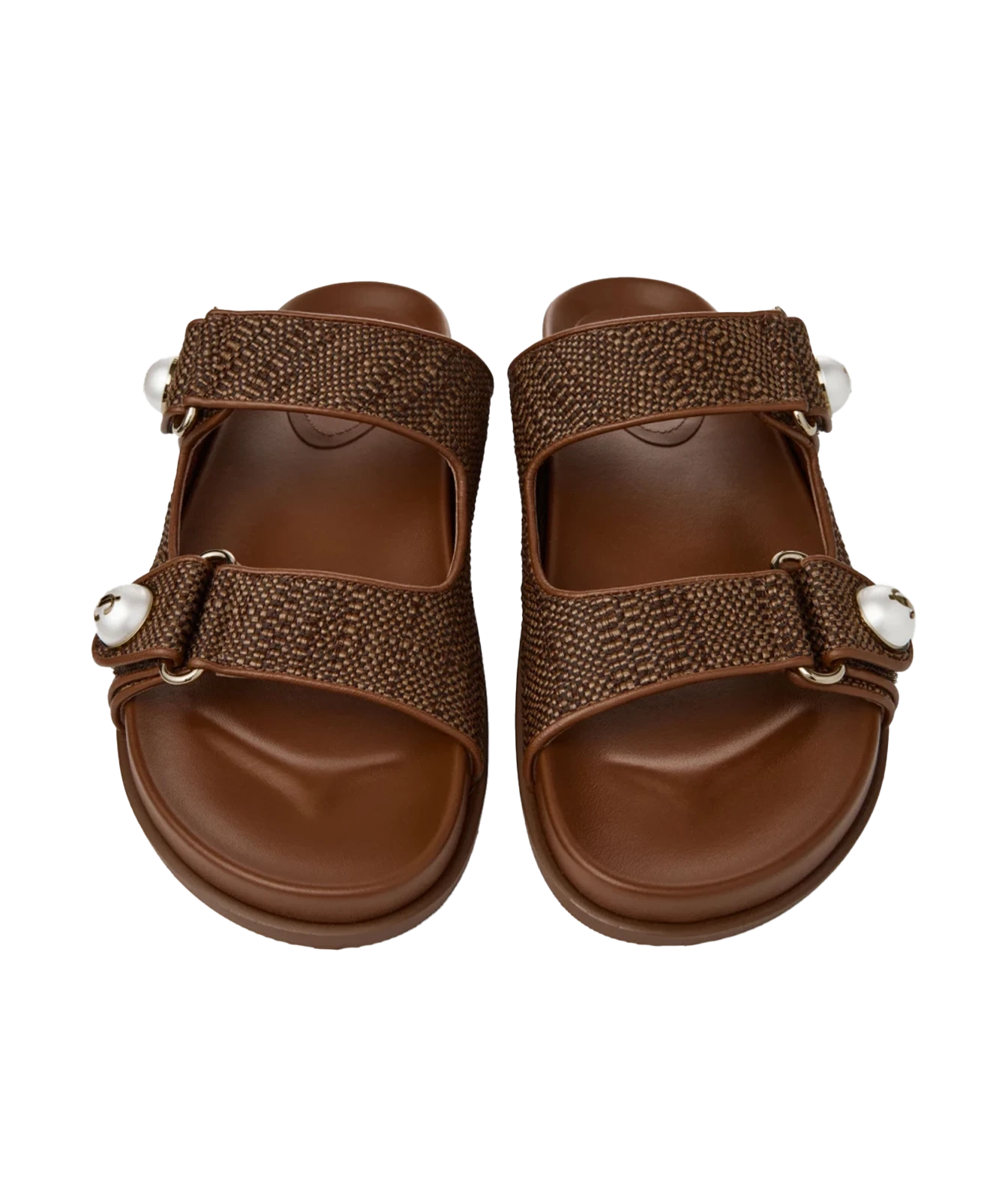 A pair of women's brown slide sandals with textured woven straps, adjustable buckles, and white decorative beads, shown from a top-down view on a white background.