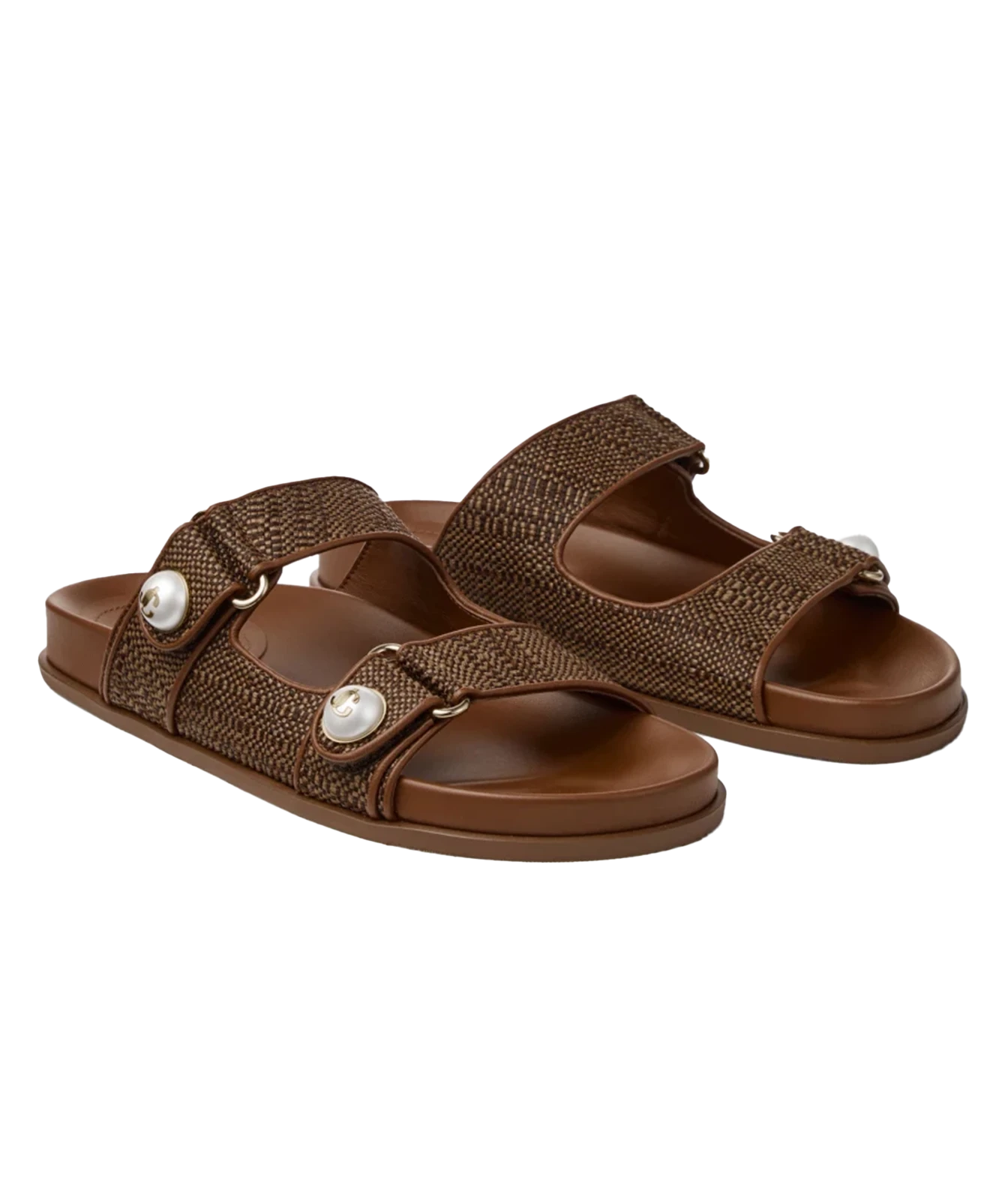 A pair of women's brown slide sandals with woven textured straps, adjustable hook-and-loop closures, and decorative white pearl-like studs, shown on a plain white background.