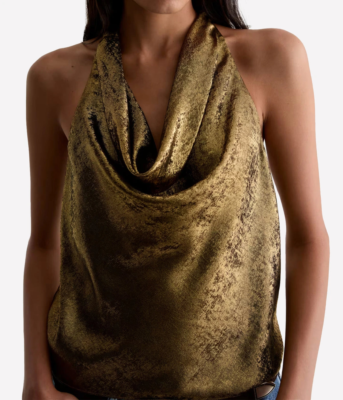 Close front view of a model wearing the AG Kacey Top in Wild Light, showing the soft cowl drape and sleeveless halter cut