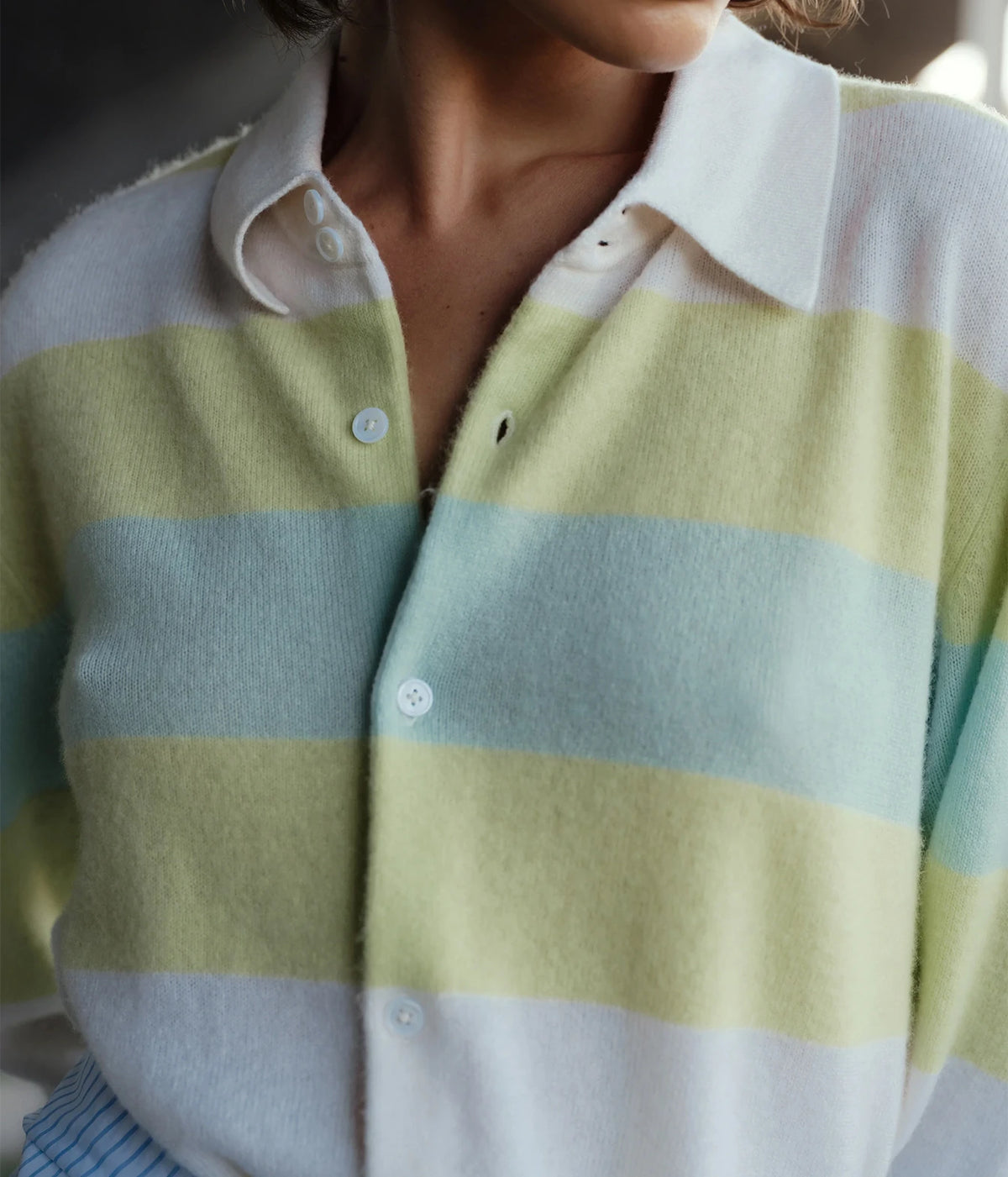 Close-up of the CISSA Rugby Cardigan in Sorbet Swirl showing the pointed white collar, button placket and striped knit texture