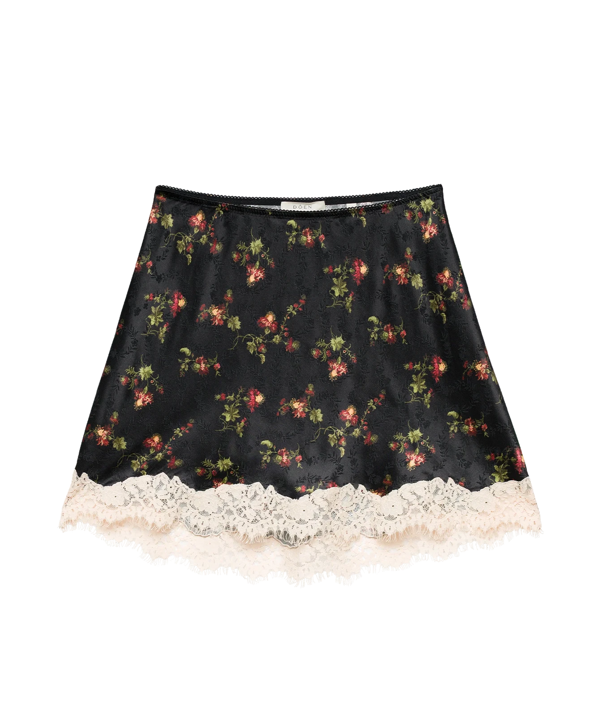 DÔEN Giulietta Skirt In Noir Hillside Thistles laid flat, showing the black floral print with red and pink blooms and the cream scalloped lace hem