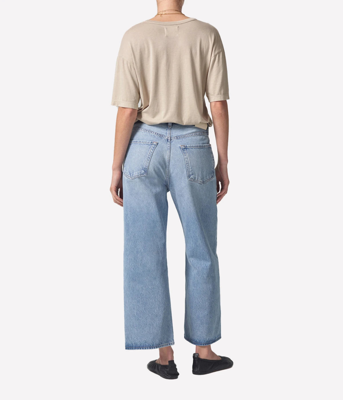 ALT Text: Vintage-inspired wide-leg jeans with a cropped hem and high-waisted fit, crafted from regenerative cotton.