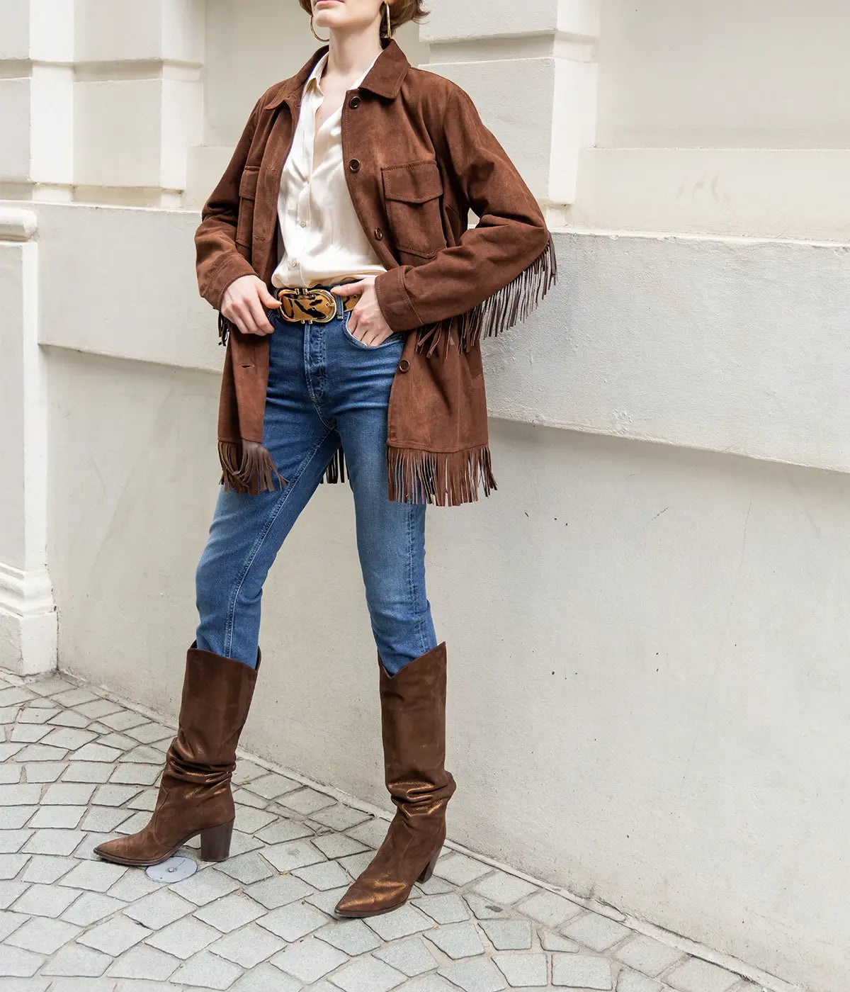 A western style jacket made from 100% lamb leather. With tassel detailing, long sleeves and button down detailing. Leather Jacket, Western Style, Elevated basic, comfortable, trans seasonal, made in Italy. 