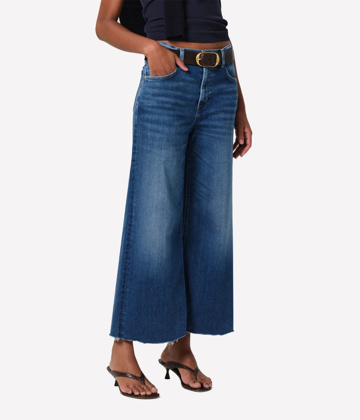 High Waist & Relaxed Fit: Sits high on the waist, offering a flattering, elongating shape. The relaxed top block ensures comfort without sacrificing style.
Vintage-Inspired Silhouette: The voluminous wide leg and cropped inseam create a retro vibe with a contemporary edge.
Raw Hem Detail: Adds a casual, unfinished look that elevates the overall design and gives a nod to modern denim trends.