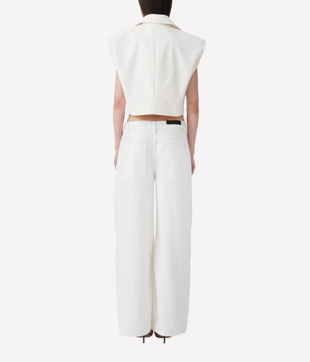 Mana Sequin Jean in White by IRO, made from 100% organic cotton, featuring all-over sequin detailing, a five-pocket design, and a slim fit in a crisp white color.