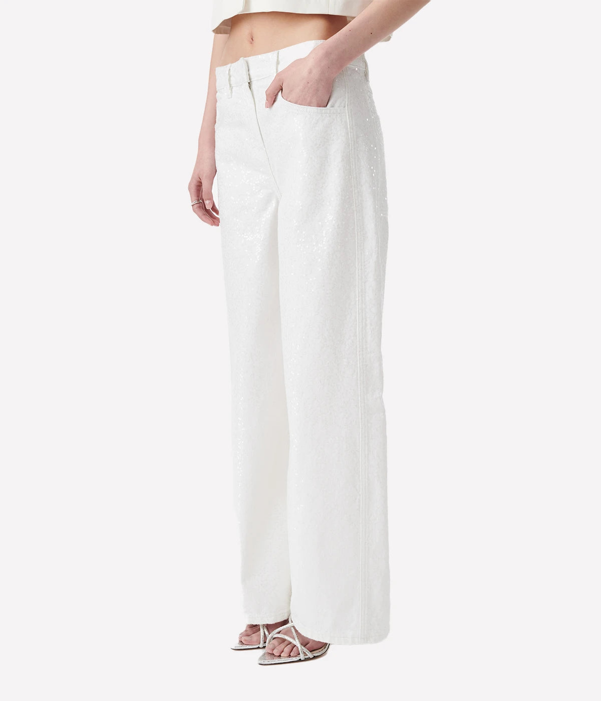 Mana Sequin Jean in White by IRO, made from 100% organic cotton, featuring all-over sequin detailing, a five-pocket design, and a slim fit in a crisp white color.