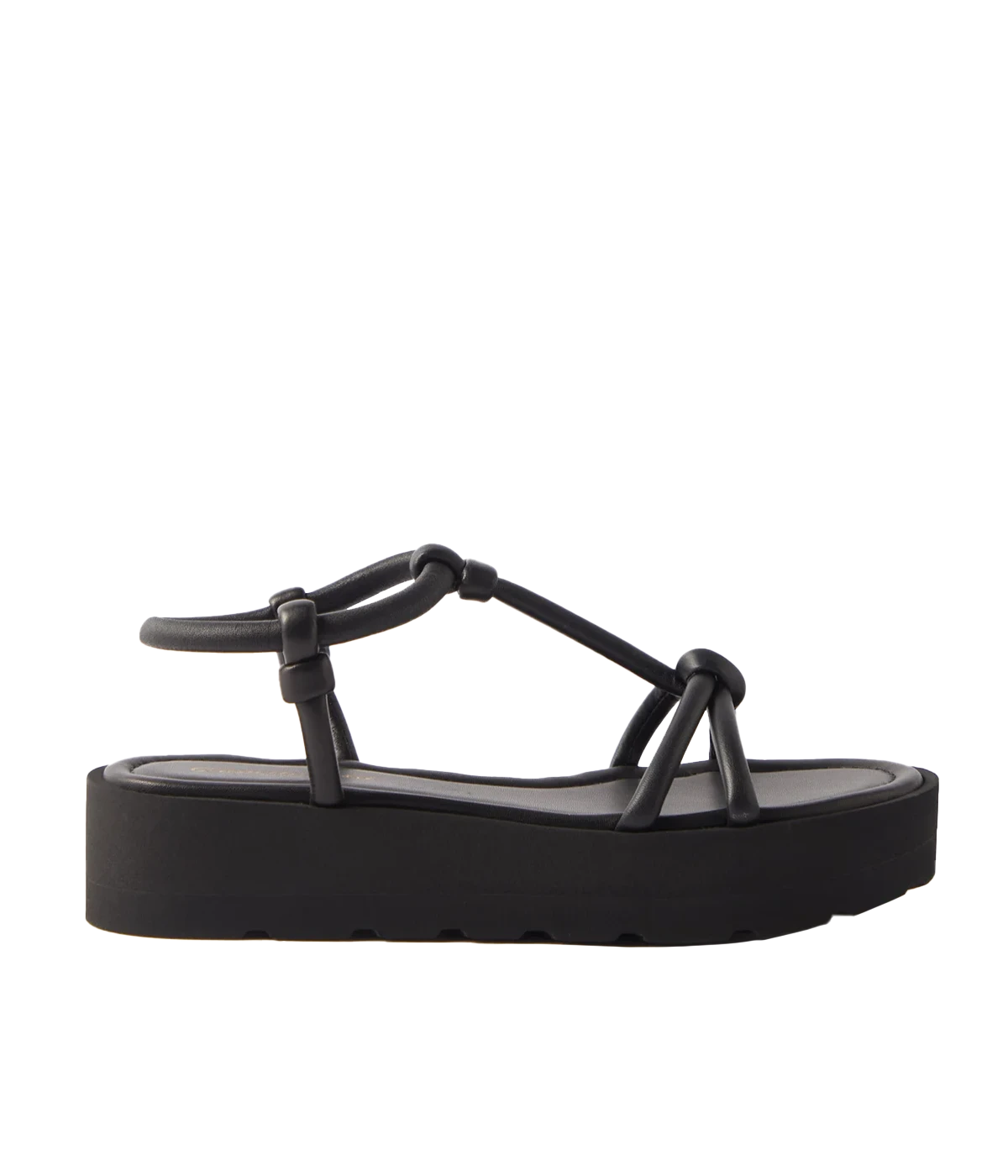 Black slip-on leather sandals. Easy to wear summer shoe, pair with your favourite summer outfit. Knotten details atop a thick rubber platform. All day comfort, perfect for walking.  