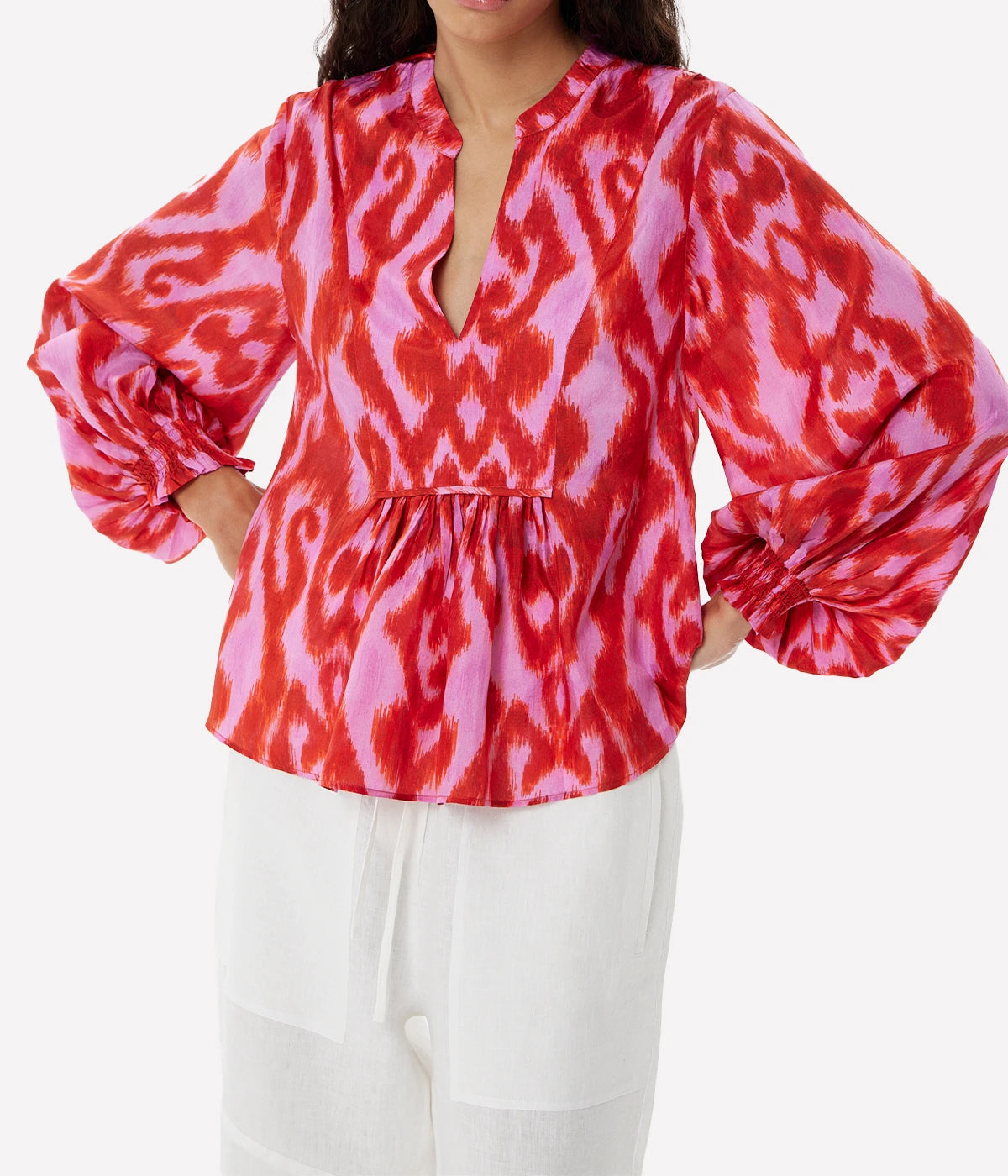 Fuchsia silk blouse with a relaxed fit, fluid draping, and vibrant colour for a playful yet elegant look.