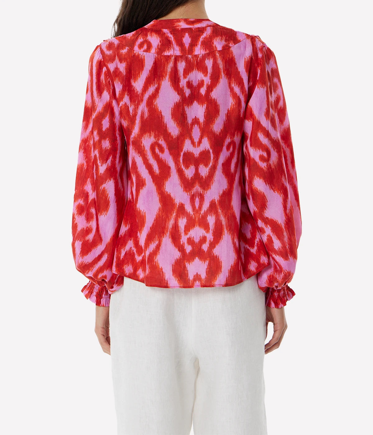 Fuchsia silk blouse with a relaxed fit, fluid draping, and vibrant colour for a playful yet elegant look.