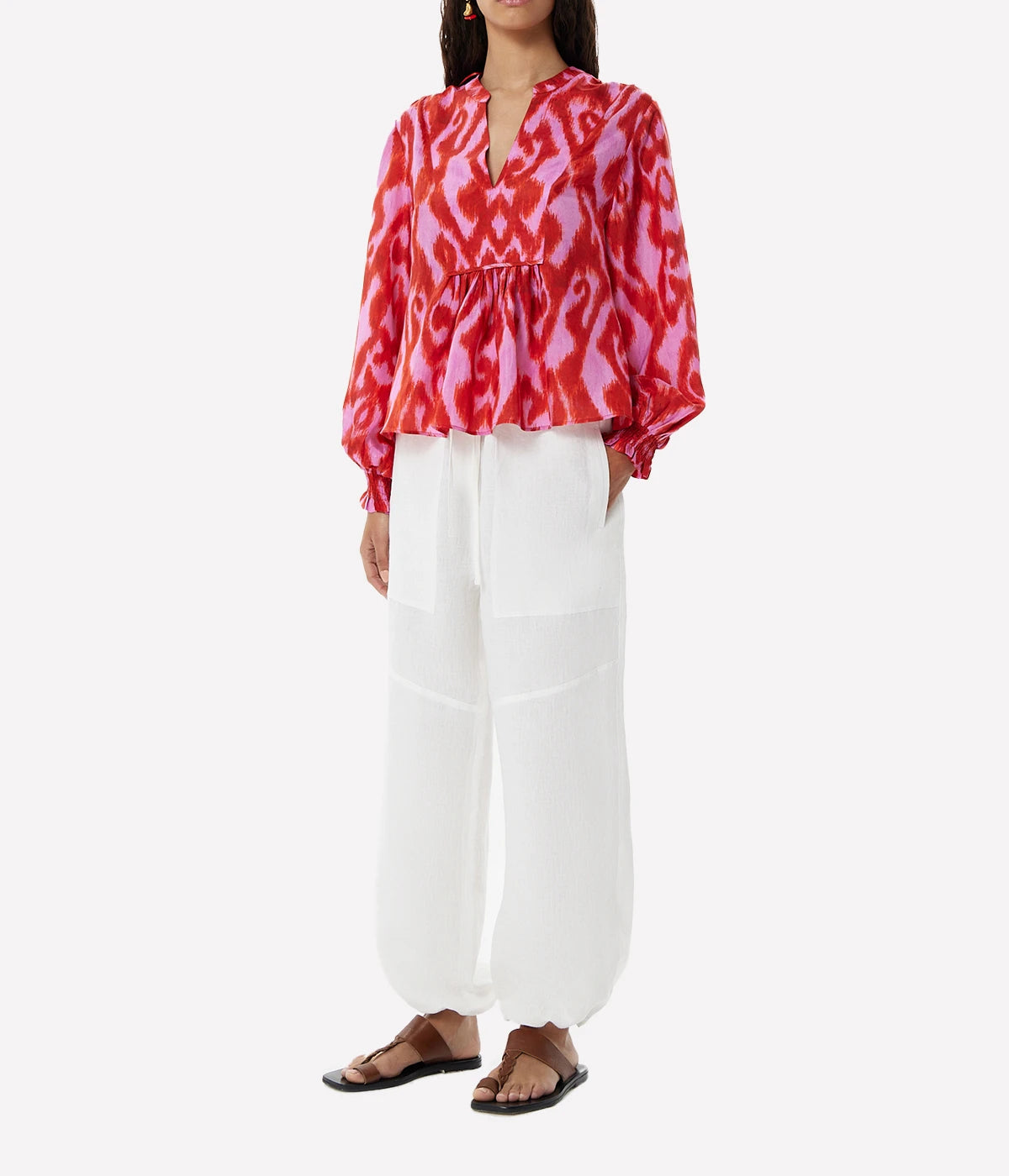 Fuchsia silk blouse with a relaxed fit, fluid draping, and vibrant colour for a playful yet elegant look.