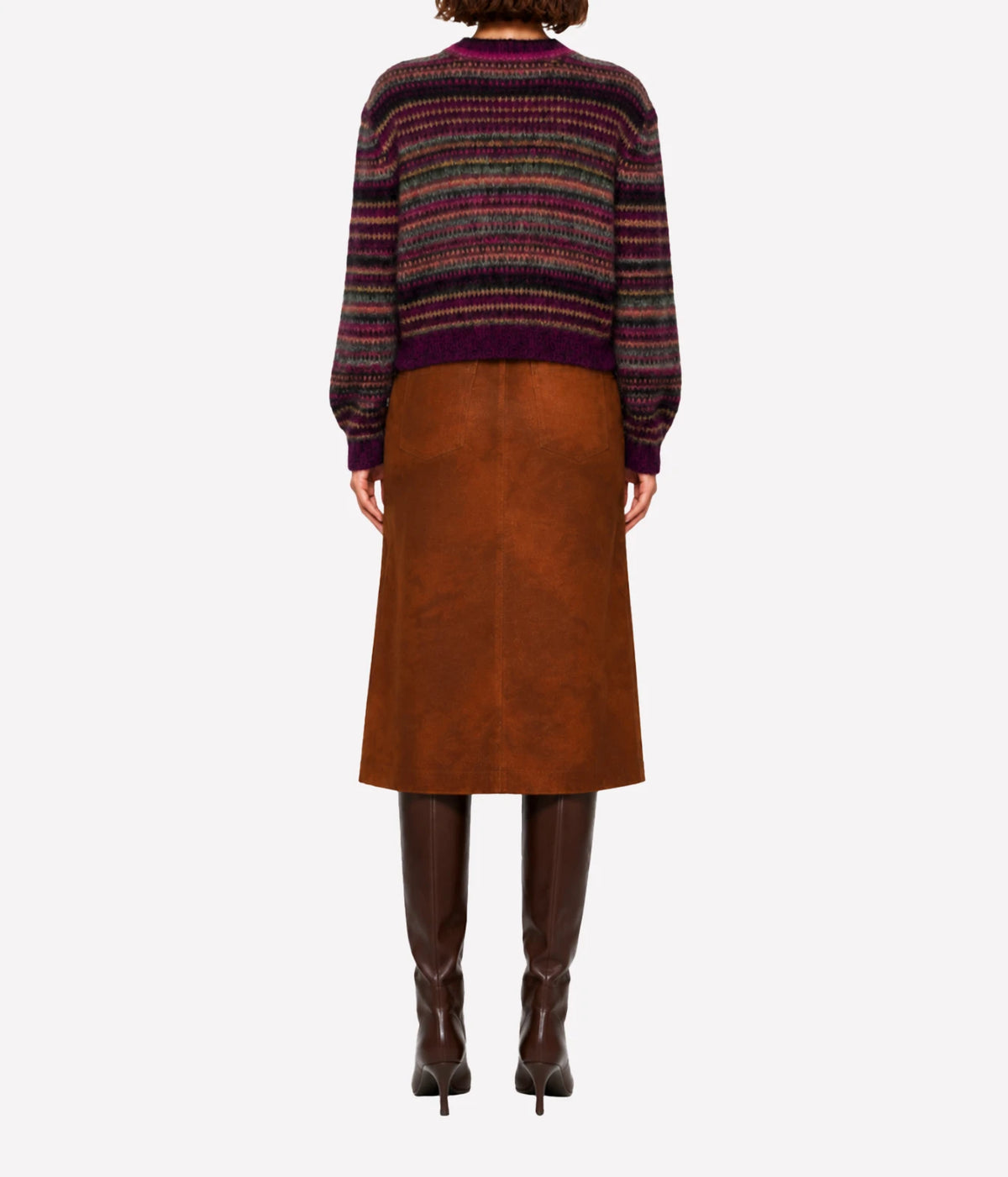 A model viewed from the back wearing a multicolour striped knit sweater, a brown suede skirt, and dark brown knee-high boots - Morine Mohair Sweater In Plum