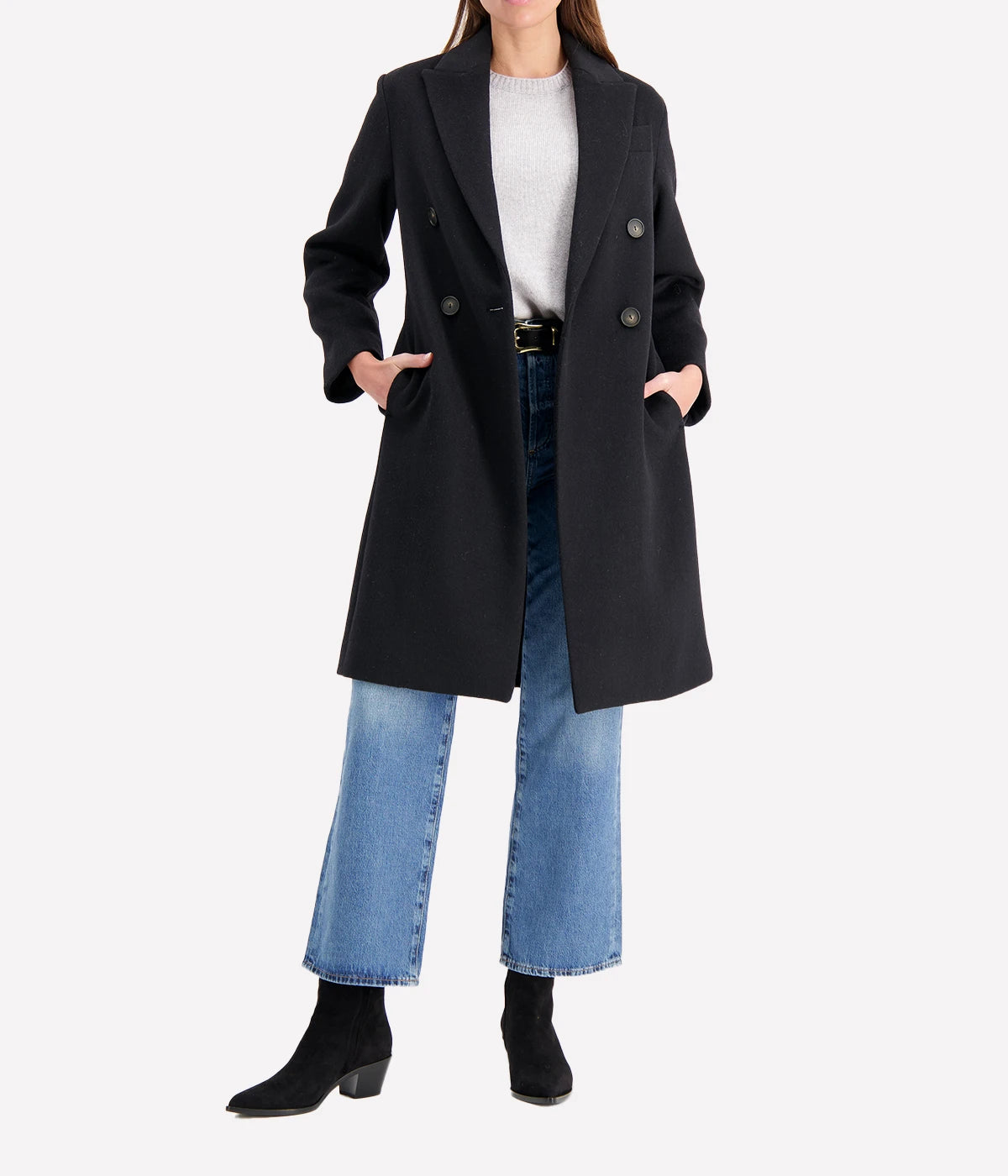 Double-breasted coat with brushed recycled wool blend, featuring peak lapels and side-seam pockets, styled for a sophisticated cold-weather look.