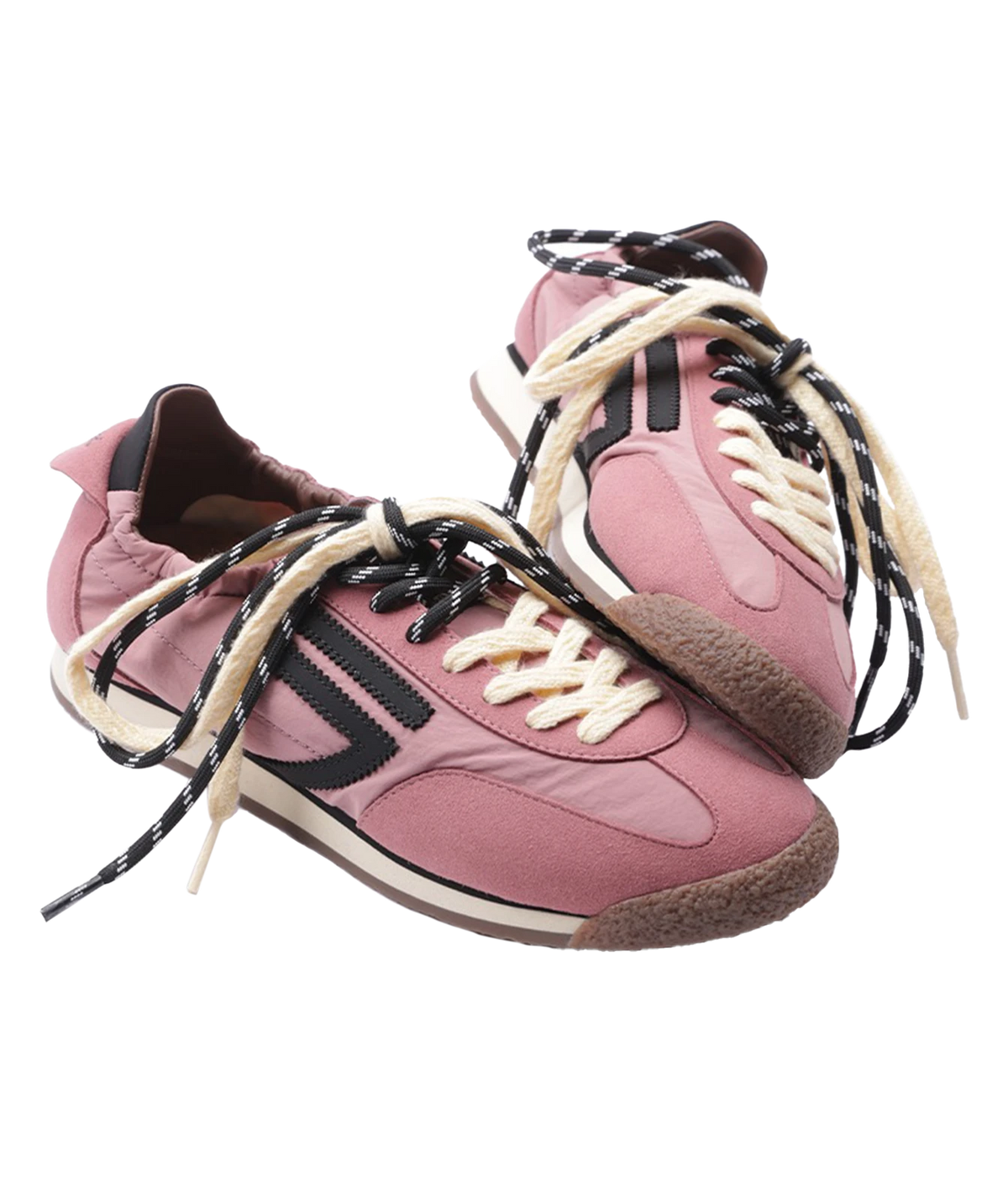 A pair of retro-style low-top sneakers in dusty pink, featuring black side stripes, cream laces, and brown textured soles, shown against a plain white background.