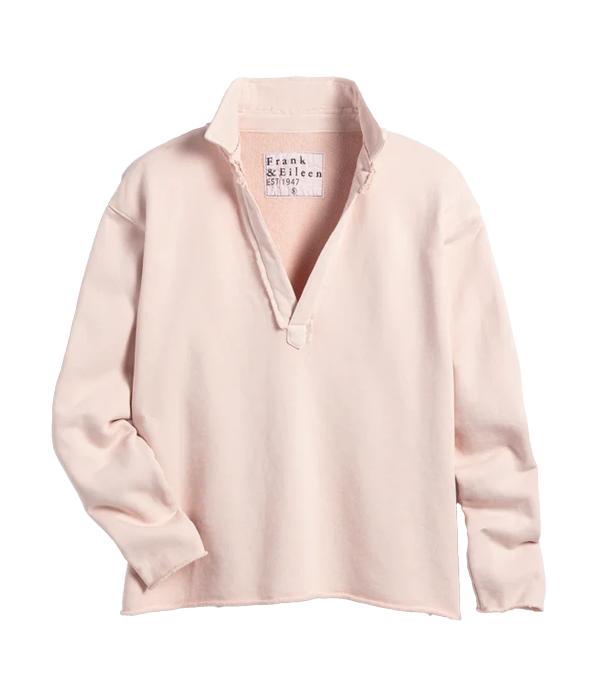 A light pink triple fleece sweatshirt with a raw hem and V neckline. Cropped without sacrificing coverage, you’ll love the sporty meets posh look of this bra friendly, wash and wear popover by Frank and Eileen. 