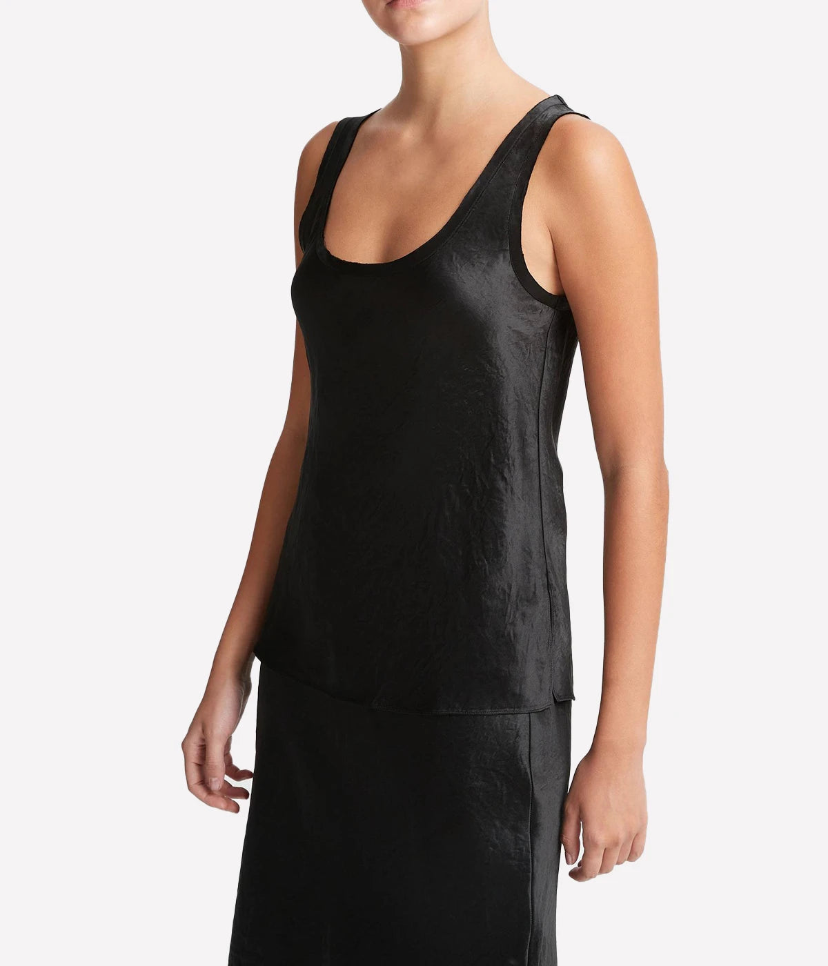 An edgy take on a silky black tank, this sleeveless black Vince tank is a versatile top. Wear this bra-friendly top with your favourite skirt or pants to your next event, or every day.
