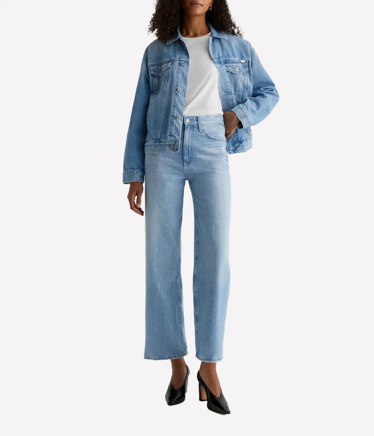 ALT text: AG Kora wide-leg jeans in light wash Sioux Rigid Denim with worn hems and five-pocket styling.