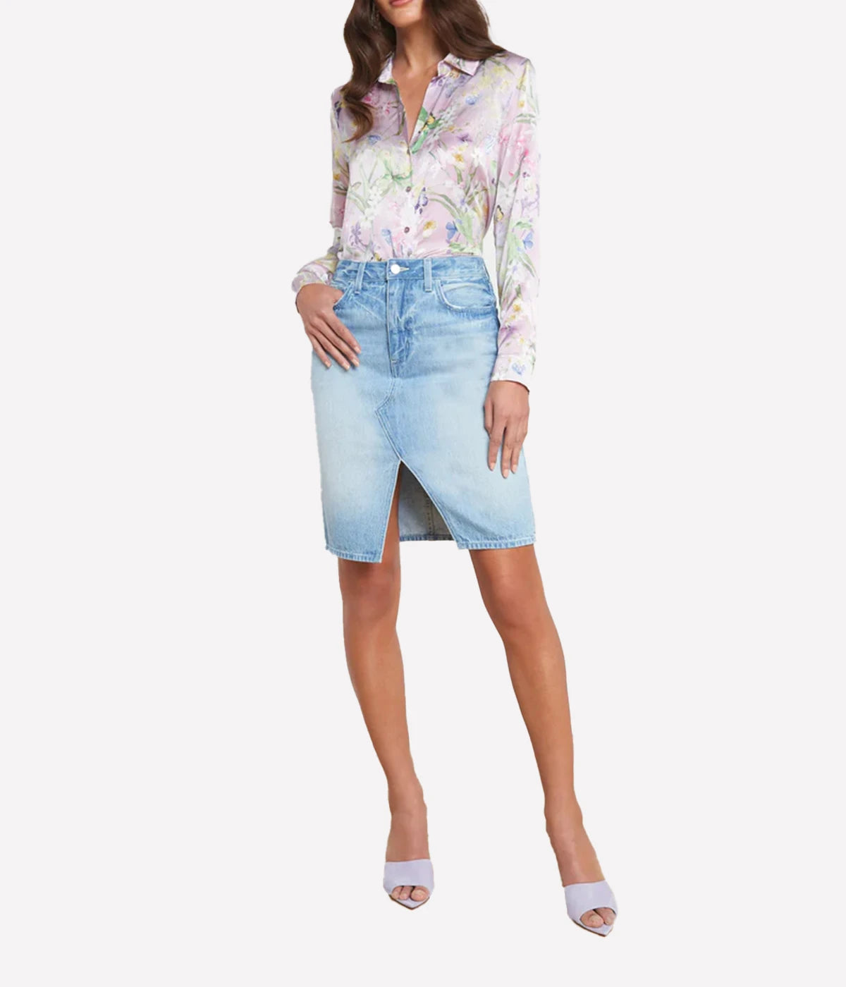 Vintage-inspired denim skirt with a split hem, styled with a linen blouse and sandals for a casual yet refined summer look.